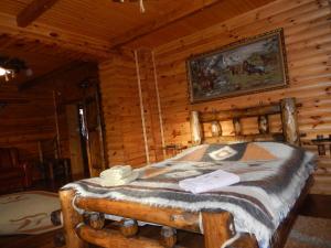 Postel nebo postele na pokoji v ubytování Гуцульська хата