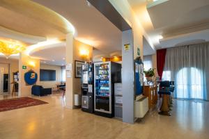 a lobby with two vending machines in a building at Venice Hotel Albatros in Mestre