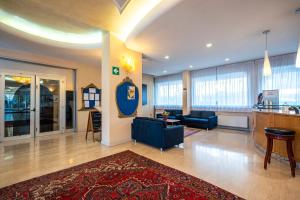 a large living room with a couch and a table at Venice Hotel Albatros in Mestre