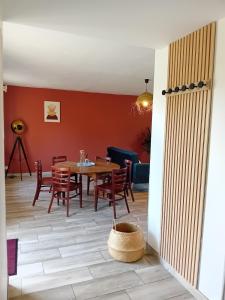 a dining room with a table and chairs at Le gîte d'Elisa in Roullours +15 photos