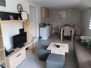 a living room with a couch and a table at Margit Haus in Stara Moravica
