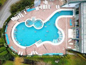 an overhead view of a swimming pool at a resort at Renovated Apartment ŽAJBELJ near Terme Topolšica in Topolšica