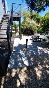 a group of benches and stairs in a park at Lorraine Loft Apartment in Gqeberha