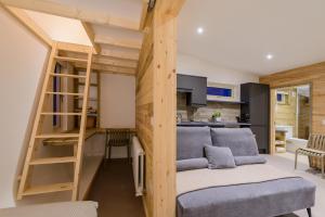 a room with a loft bed and a kitchen at Killarney Glamping - Ross Road in Killarney