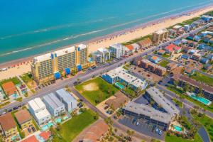 an aerial view of a beach with buildings and the ocean at Penthouse Beachfront Views Renovated condo in South Padre Island