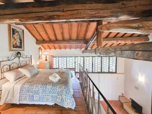 a bedroom with a bed in a room at Podere Raggio Di Sole in San Gimignano