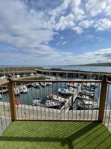 a view of a marina with boats in the water at Apartment in Banff in Banff