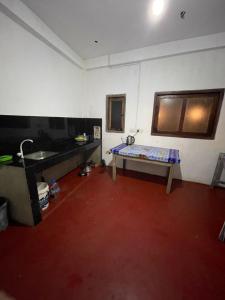 a room with a sink and a table in it at saffronvilla in Haputale