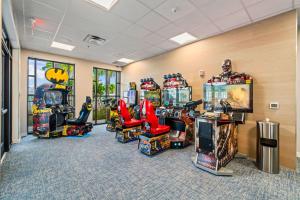 a room with arcade games and video game machines at 16148 Palm Frond Ave in Orlando
