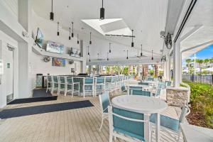 a restaurant with chairs and tables and a bar at 16148 Palm Frond Ave in Orlando