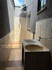 a bathroom with a sink in a building at Apartamento Lençóis in Barreirinhas +2 photos