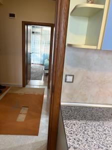 a view of a hallway with a counter and a door at Апартамент център Поли in Sandanski