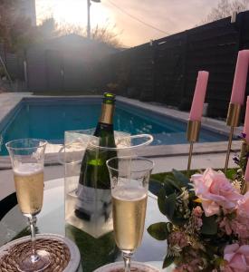 a bottle of wine and two glasses of champagne at La Perle in Marseille