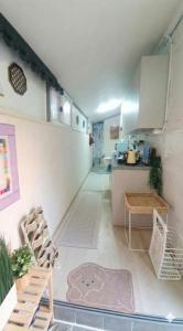 a living room with a table and a kitchen at Marine Mini House in Busan +37 photos