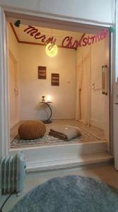 a view of a room with a happy christmas sign on the door at Marine Mini House in Busan