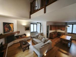 a living room with a couch and a table at Cascina Borgofrancone in Gera Lario