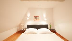 Ein Bett oder Betten in einem Zimmer der Unterkunft Altstadt Gästehaus Drewes Wale