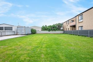 an empty yard in front of a building at Adrift - Oceanfront - Pets Welcome in Middleton +11 photos