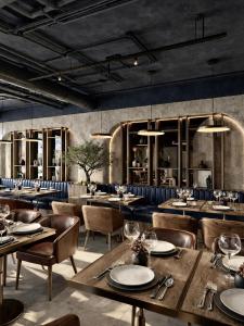 a dining room with wooden tables and chairs at Hotel Centar Sanski Most in Sanski most +22 photos