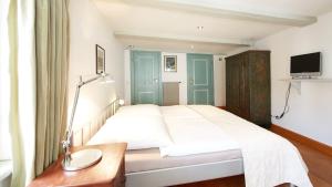 Ein Bett oder Betten in einem Zimmer der Unterkunft Altstadt Gästehaus Drewes Wale