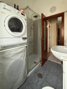 a bathroom with a washing machine on the wall at Donna Felì in Gragnano +23 photos