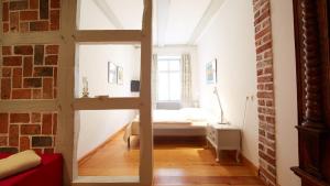 Ein Bett oder Betten in einem Zimmer der Unterkunft Altstadt Gästehaus Drewes Wale