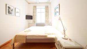 Ein Bett oder Betten in einem Zimmer der Unterkunft Altstadt Gästehaus Drewes Wale