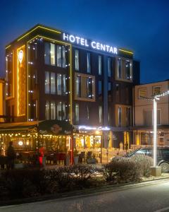 a hotel centrale building at night with lights at Hotel Centar Sanski Most in Sanski most