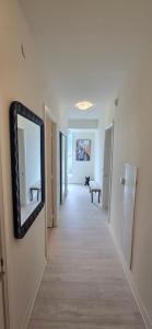 a hallway with a mirror on a wall at Corner unit 3 bath and 2 bed in Vaughan