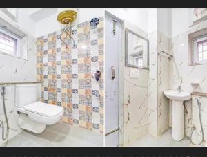a bathroom with a toilet and a sink at Hotel RP Residency in Nakraunda