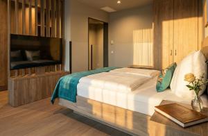 a bedroom with a large bed and a television at H24 Stadthotel Bernau in Bernau bei Berlin +31 photos