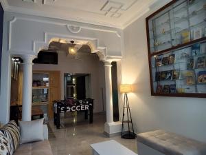 a living room with a ping pong table in it at Bed N Banter - Lucknow in Lucknow