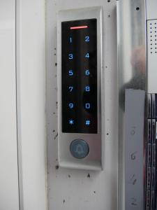 a close up of a remote control on a door at Guest House Il Colibri' in Bologna