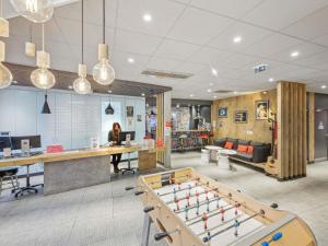 an office with a pool table in the middle at ibis Saint Germain en Laye Centre in Saint-Germain-en-Laye