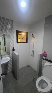 a bathroom with a toilet and a sink at joyful House Naiyang 238 in Nai Yang Beach +13 photos