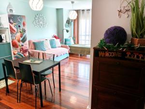 a living room with a table and a couch at Flor de Lis in Medina de Pomar