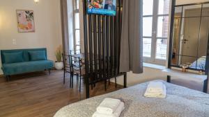 a room with a bed and a table and a couch at ISIDORA home in Rethymno +39 photos