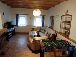 a living room with a couch and a table at Chalupa u Bruna in Ruprechtice