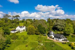 an aerial view of a house on a green field at The Roost in Saltash