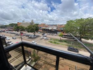 a view from a balcony of a parking lot at Hotel Master Blue - Brasília in Ceilândia