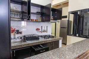 a kitchen with a sink and a counter top at Espacio Ideal 101 in Yopal