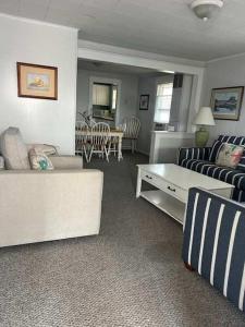 a living room with a couch and a table at OCHG 306 Talbot Top in Ocean City