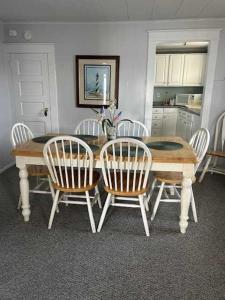 a dining room table with four chairs around it at OCHG 306 Talbot Top in Ocean City