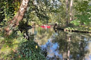 a group of people in a boat on a river at Baumhaus Baum 4 in Burg