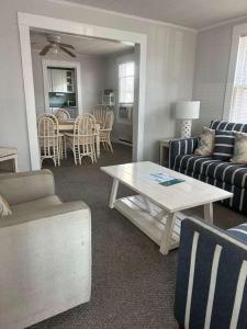 a living room with a couch and a table at OCHG 306 Talbot in Ocean City