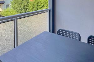 a blue table and chairs on a balcony at Libelle in Lübben