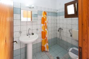 a bathroom with a sink and a toilet at Dream House in Agia Paraskevi +6 photos