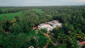 an aerial view of a house in the middle of a forest at Sharta Yala in Tissamaharama