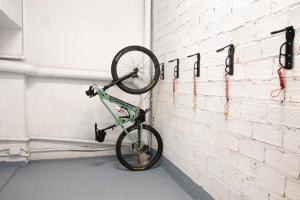 a bike hanging on a wall in a garage at Salon Suites in Tremp