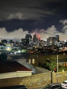 a view of a city skyline at night at Bo-Kaap Double Room with High Ceiling in Cape Town